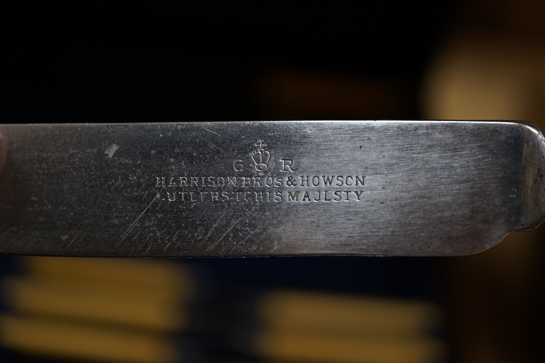 A 20th century oak cased canteen of cutlery, Harrison Bro’s & Howson, the knives with ivorine handles 47cm wide